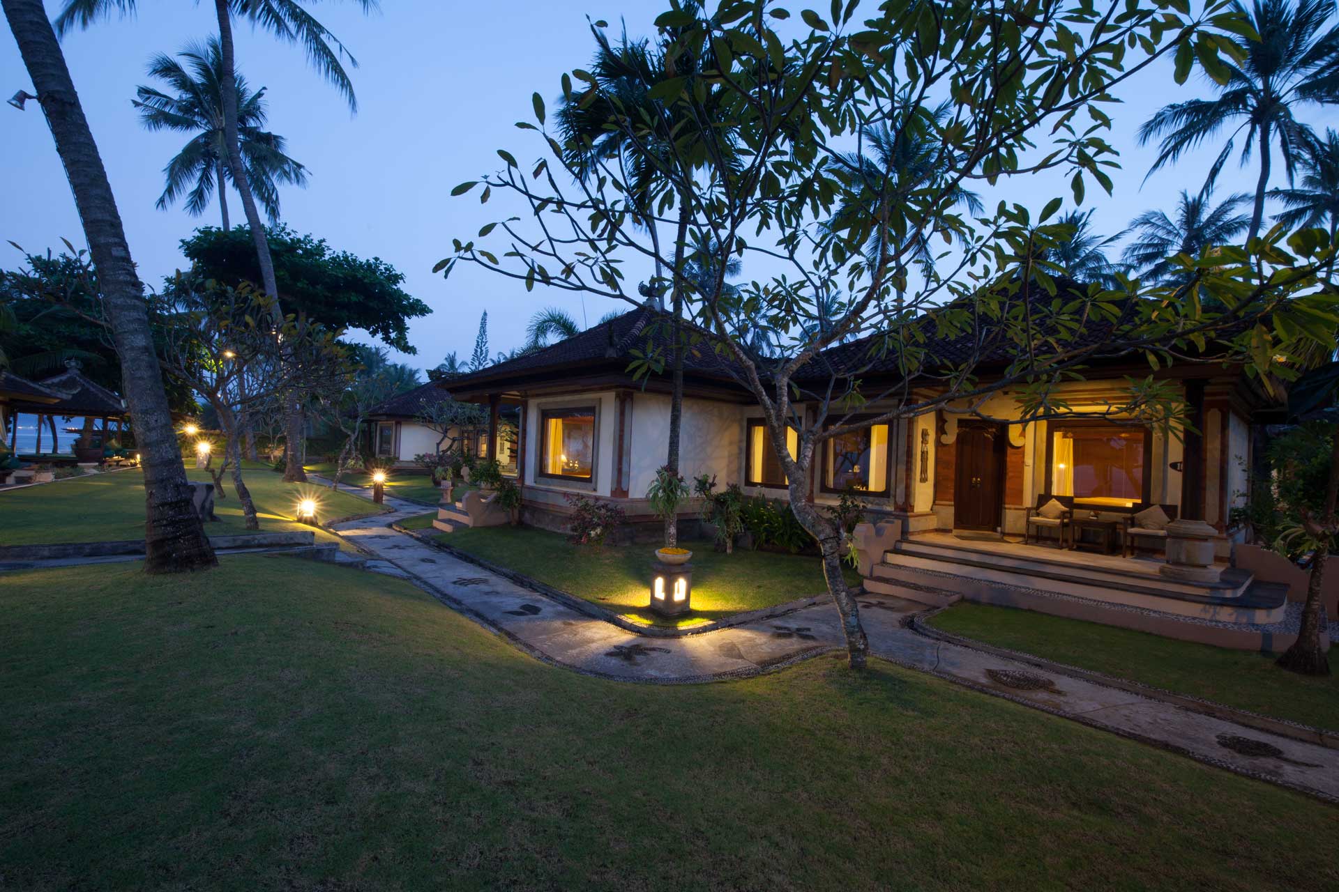 Puri Bagus Candidasa rooms and garden at night