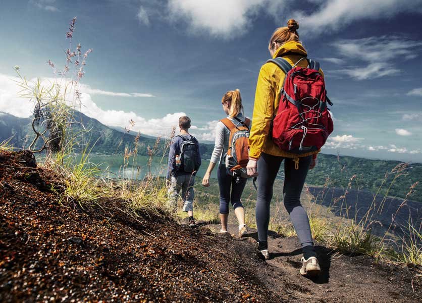 Three people mountain trekking