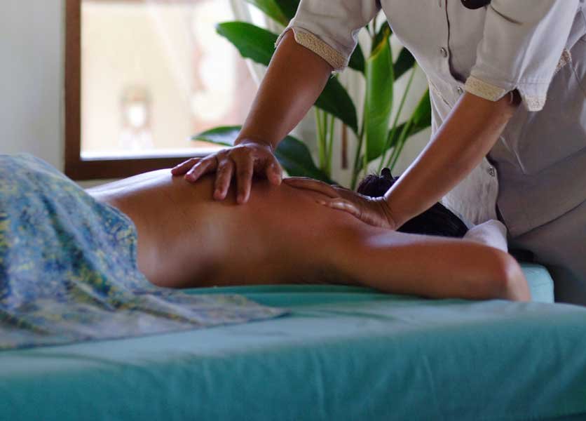 A lady being massaged with Puri Sense Body Massage