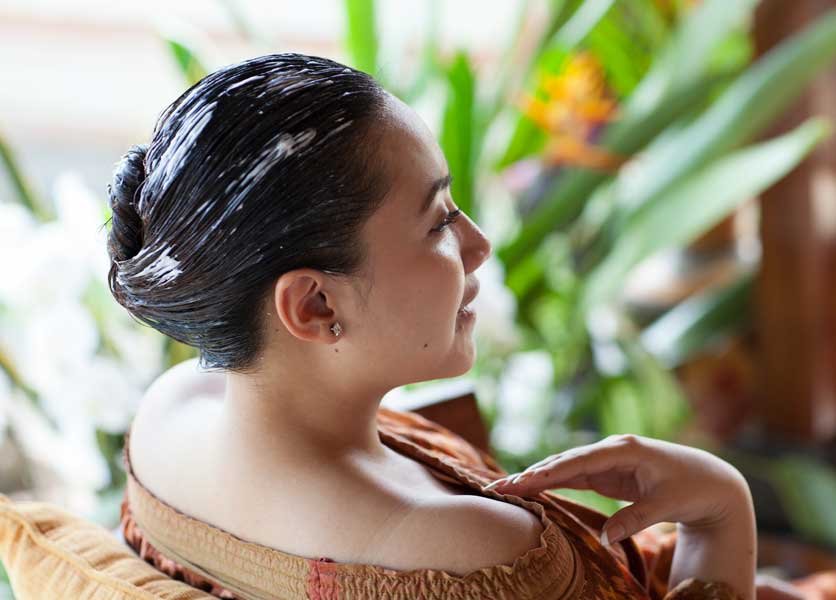 A lady undergoing hair spa