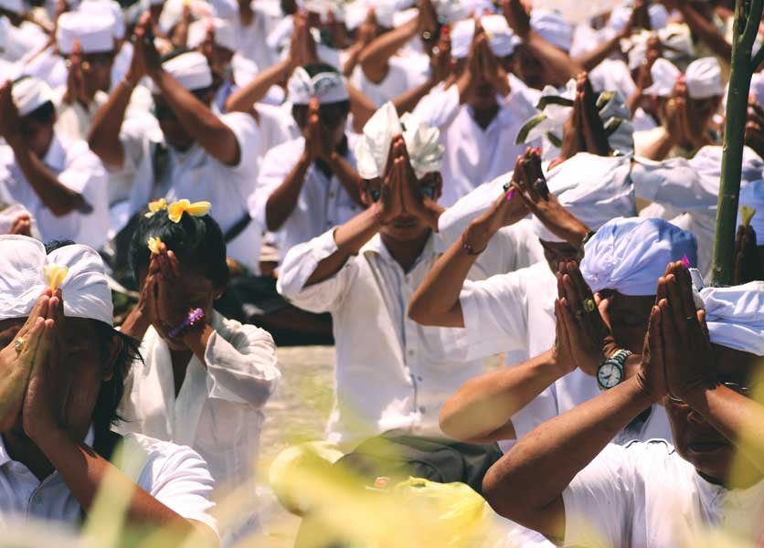 Group of Balinese people praying together