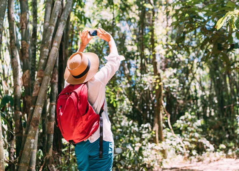 Woman taking pictures while trekking around Candidasa